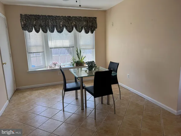 a dining room that has a table and chair in it