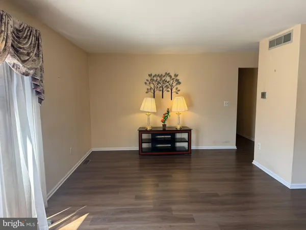 a view of a livingroom with wooden floor