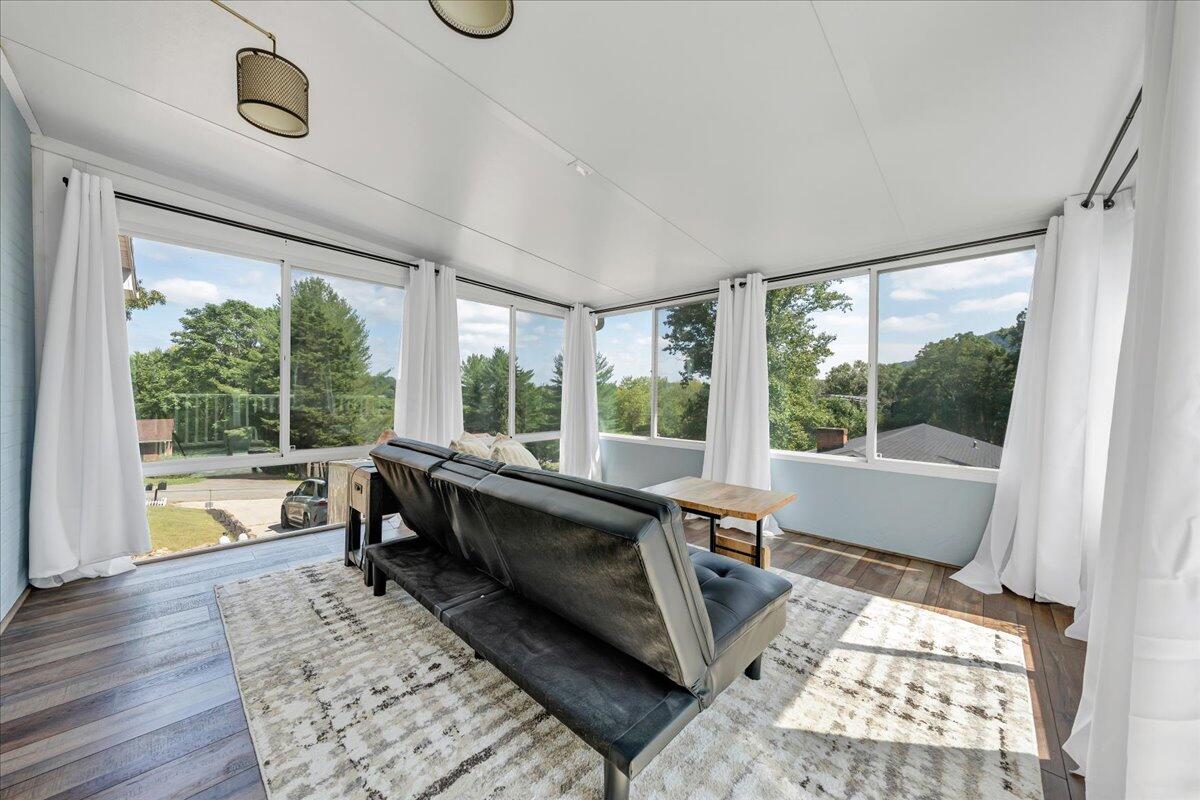 240 Lakeshore Terrace Road Hardy, VA 24101 - Photo 29 of 102 a large white room with a large window and wooden floor