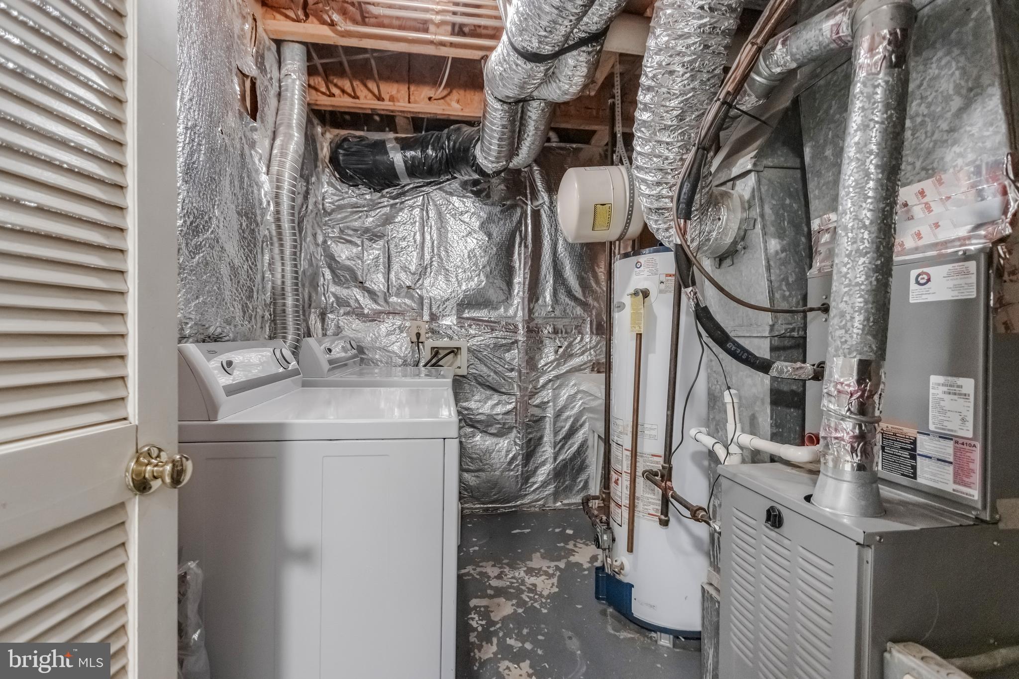 45550 Whitcomb Square Sterling, VA 20166 - Photo 19 of 24 a utility room with multiple dryer and washer