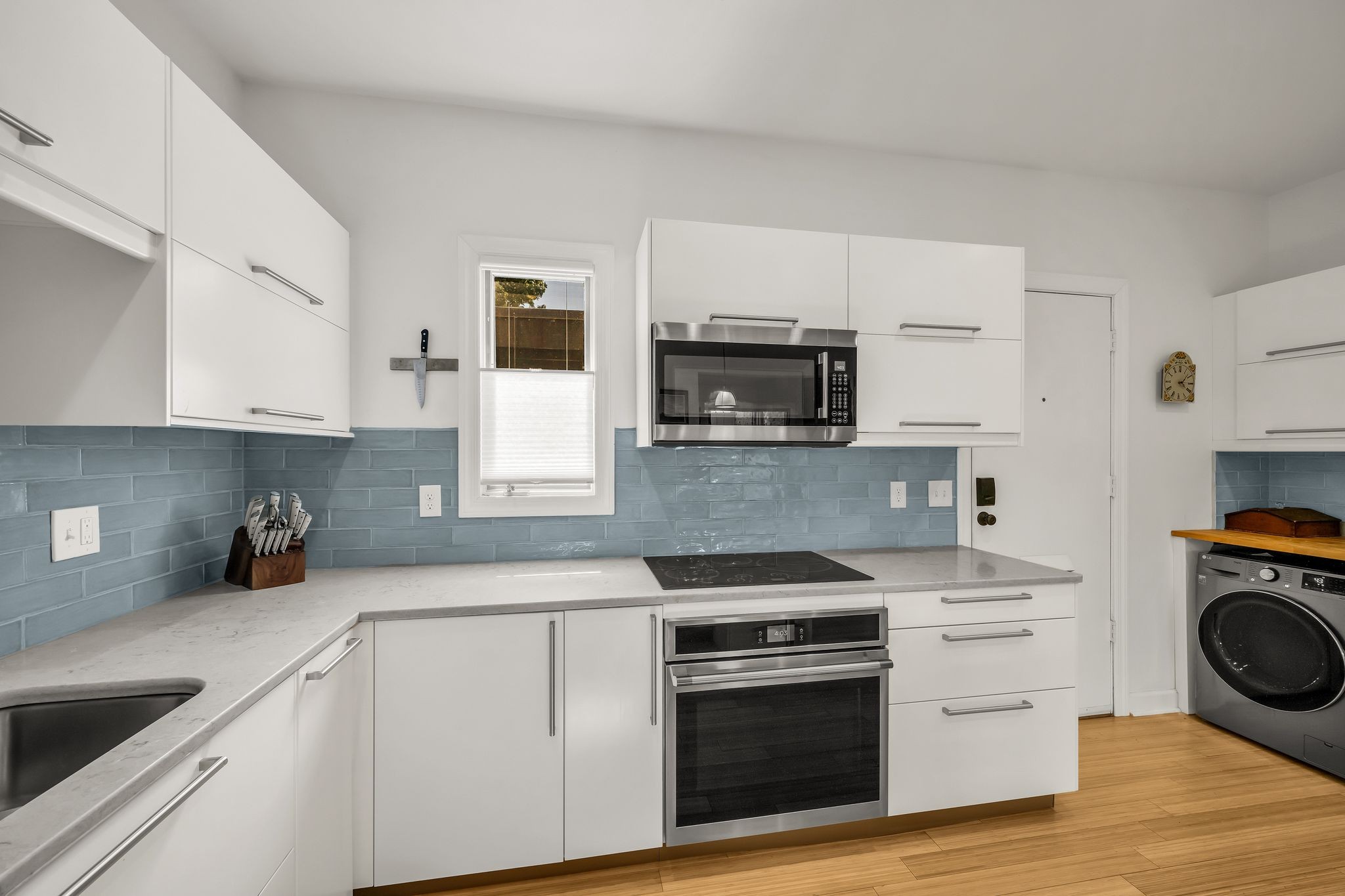 694 Timber Lane Nashville, TN 37215 - Photo 8 of 30 a kitchen with cabinets stainless steel appliances and wooden floor