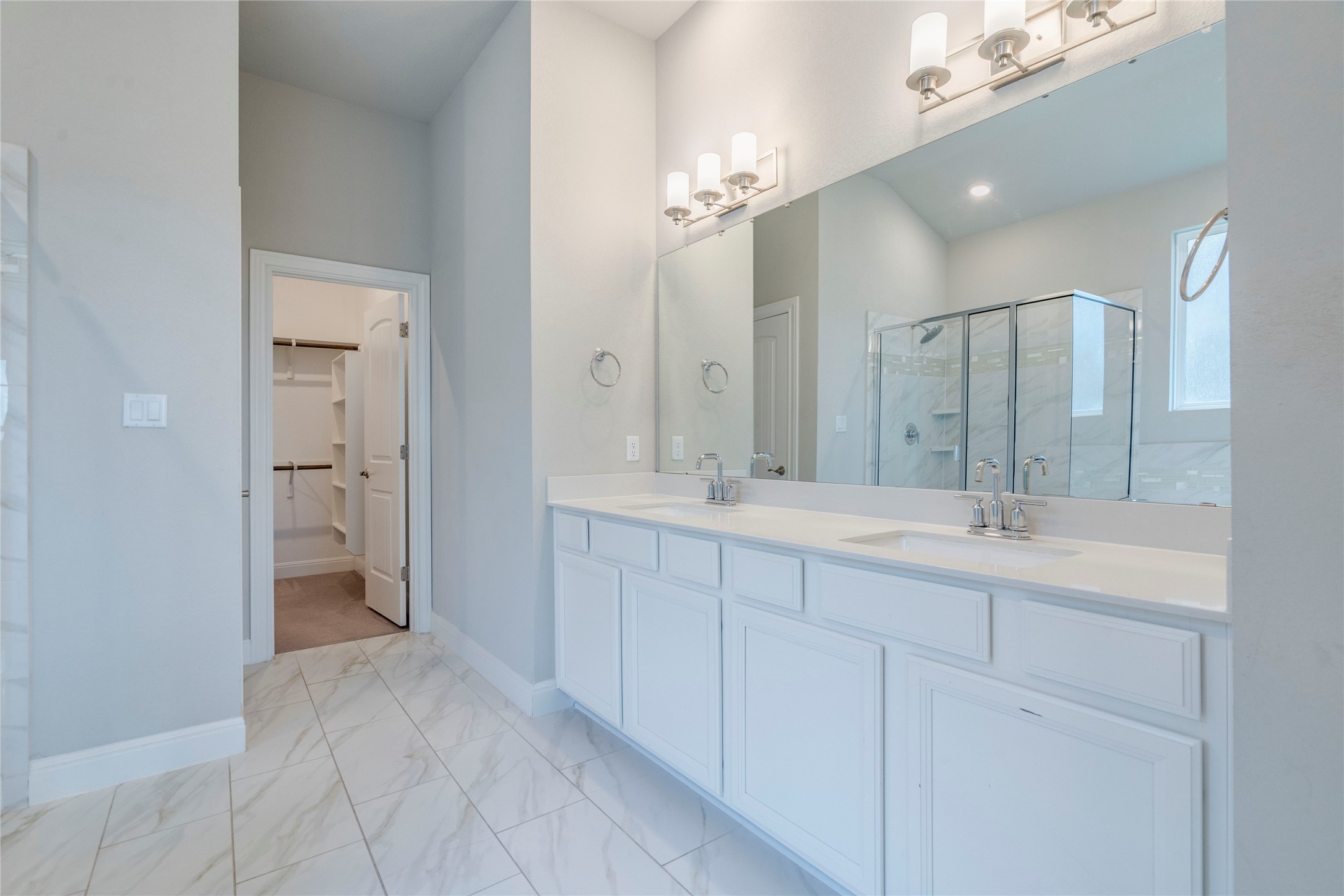 130 Sierra Blanca Road Dripping Springs, TX 78620 - Photo 15 of 24 a bathroom with a double vanity sink and a mirror