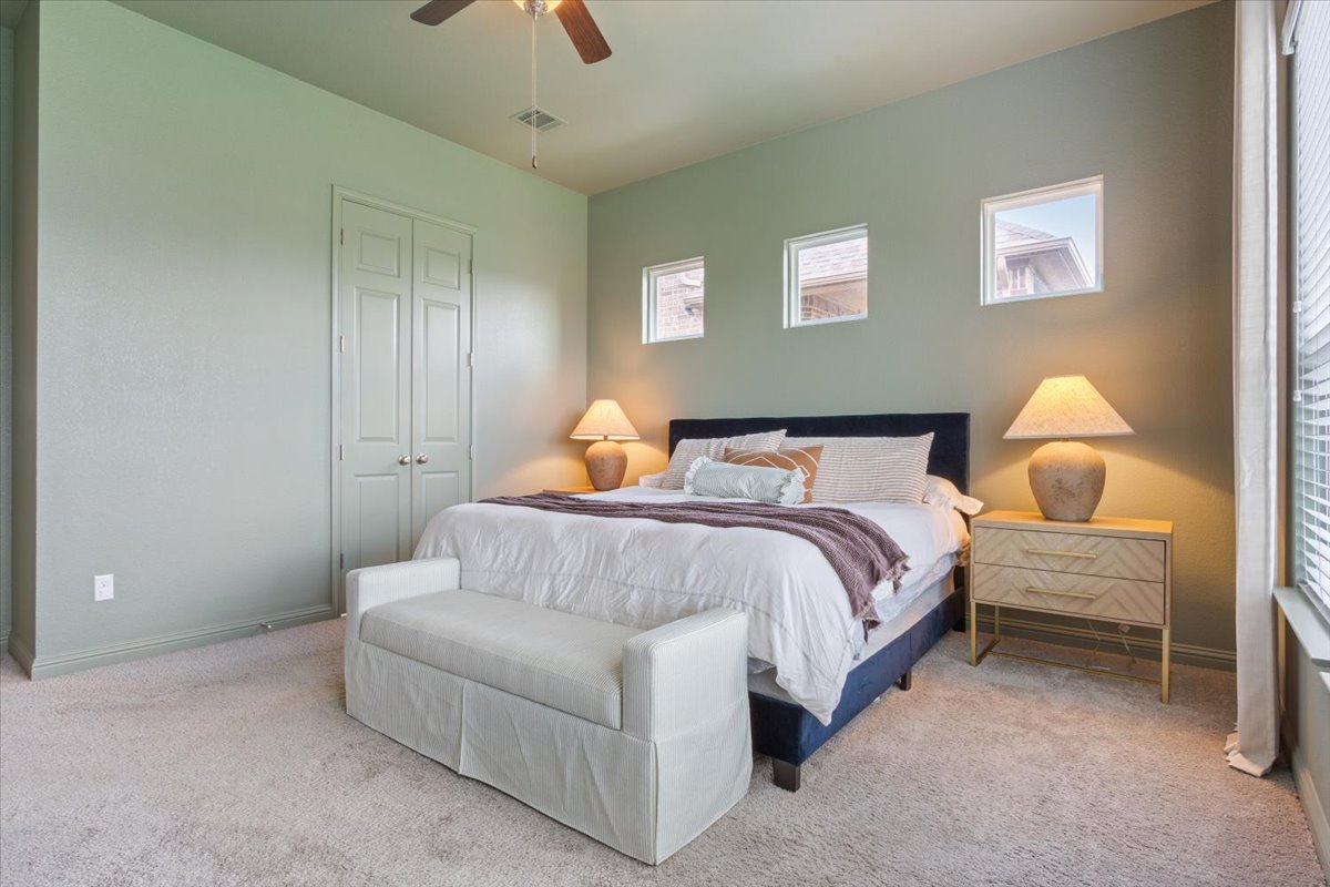 424 Millard Street Georgetown, TX 78628 - Photo 17 of 37 Well-lit and cozy, this bedroom offers comfort and a sense of calm.