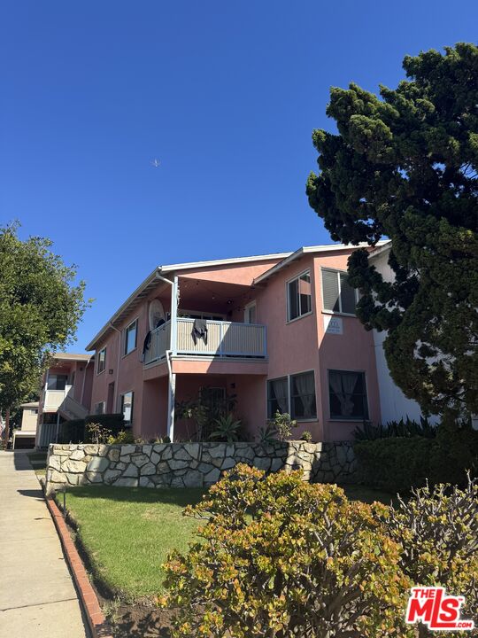 3714 Corinth Avenue Los Angeles, CA 90066 - Photo 2 of 5 a front view of a house with a garden