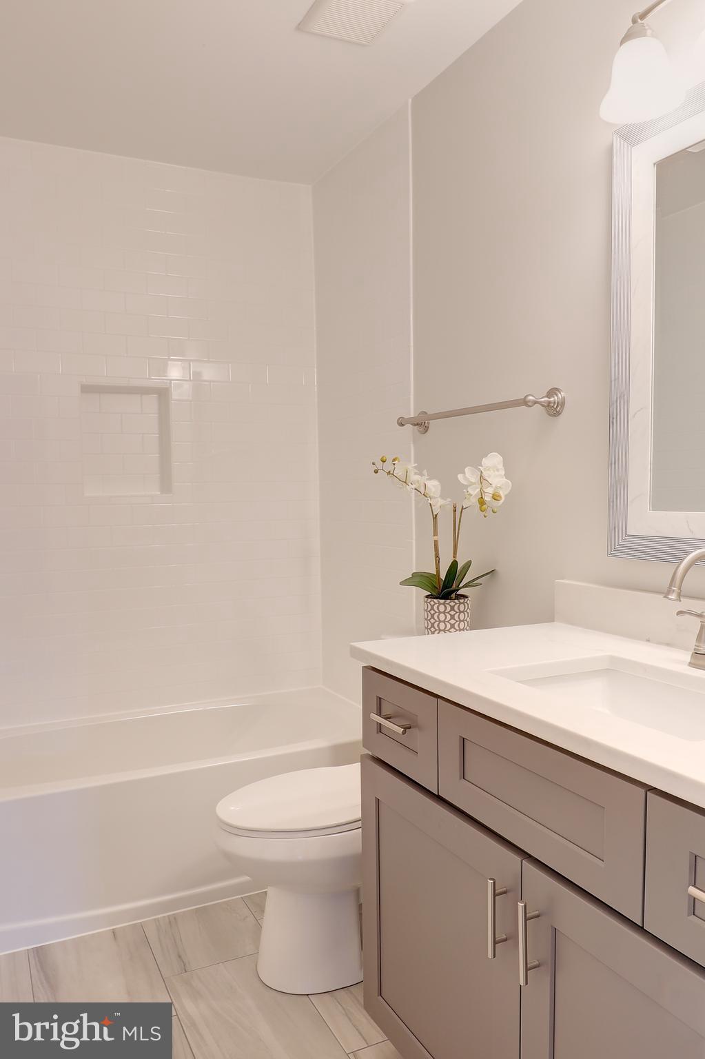 695 Hillmeade Road Edgewater, MD 21037 - Photo 25 of 28 a bathroom with a sink a toilet and shower