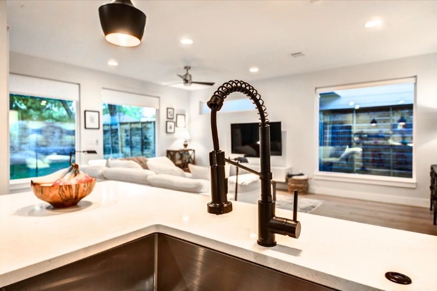 916 East 50th Street, Unit 1 Austin, TX 78751 - Photo 7 of 36 Matte black plumbing fixtures pair perfectly with the light quartz countertops throughout the home.