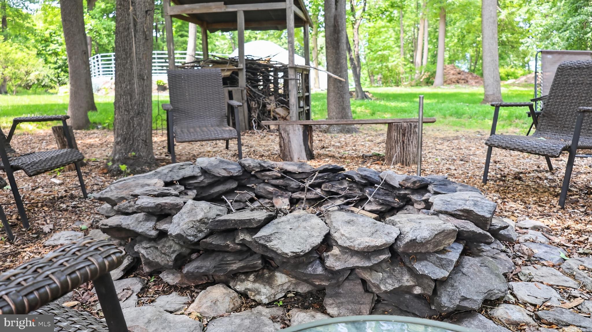 257 Hill Road New Holland, PA 17557 - Photo 90 of 94 Cozy fire pit nestled in nature.