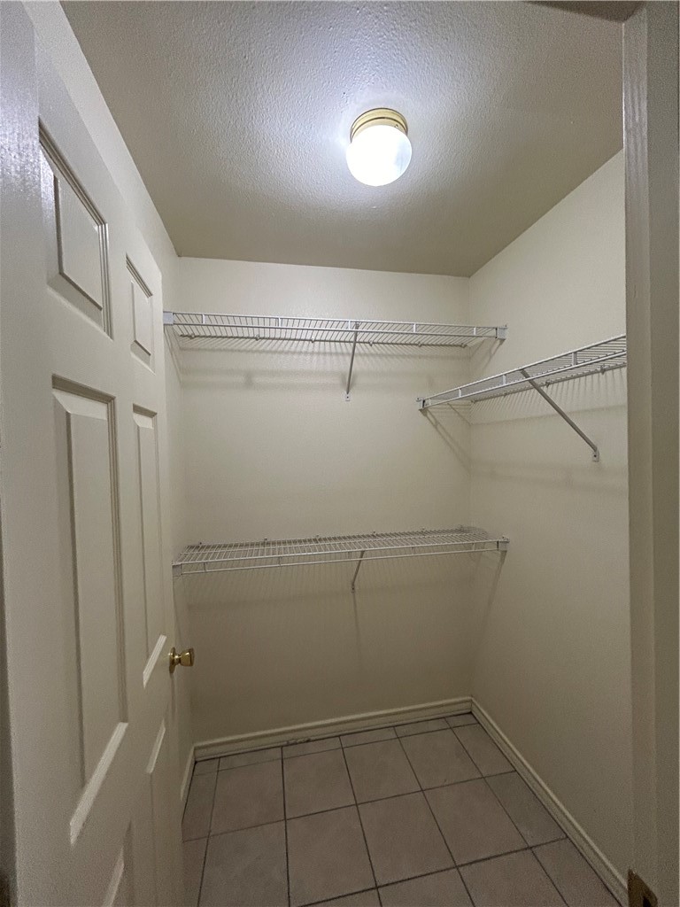 1401 Dewitt Street Corpus Christi, TX 78418 - Photo 9 of 11 a view of a room with racks on the wall
