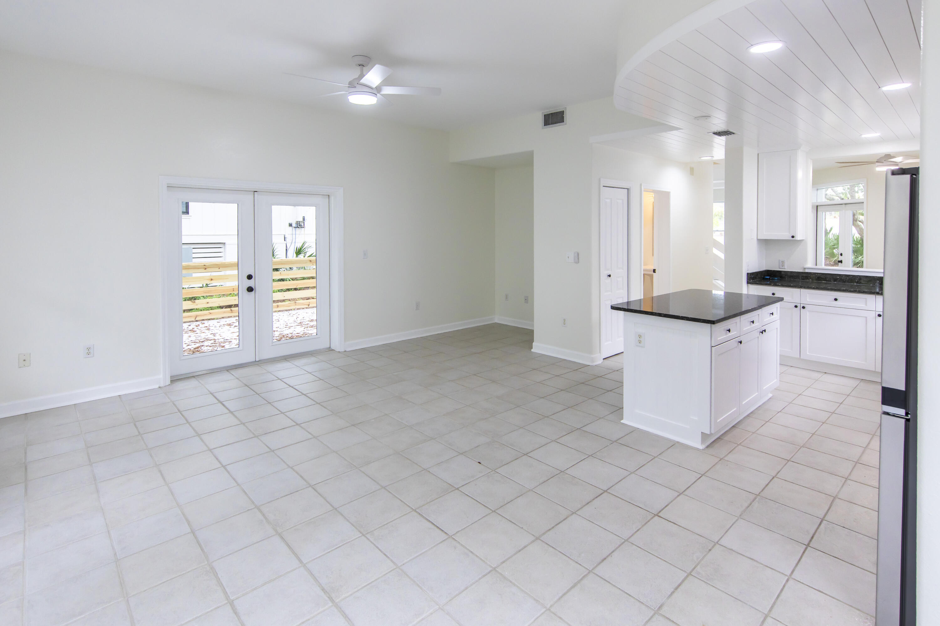 51 Loon Lake Drive Santa Rosa Beach, FL 32459 - Photo 13 of 49 an empty room with kitchen and wooden floor