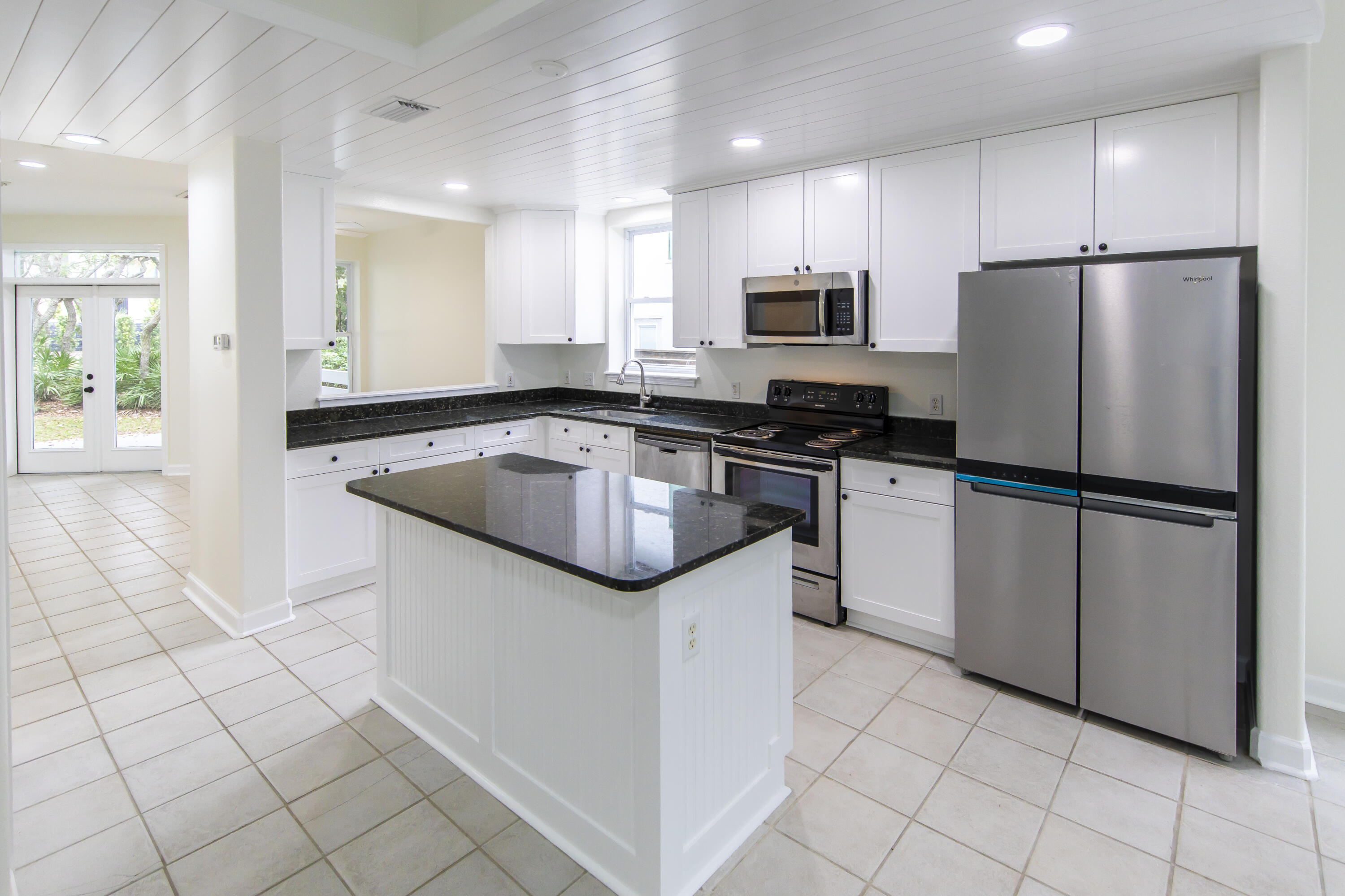 51 Loon Lake Drive Santa Rosa Beach, FL 32459 - Photo 15 of 49 a kitchen with granite countertop a sink appliances and cabinets