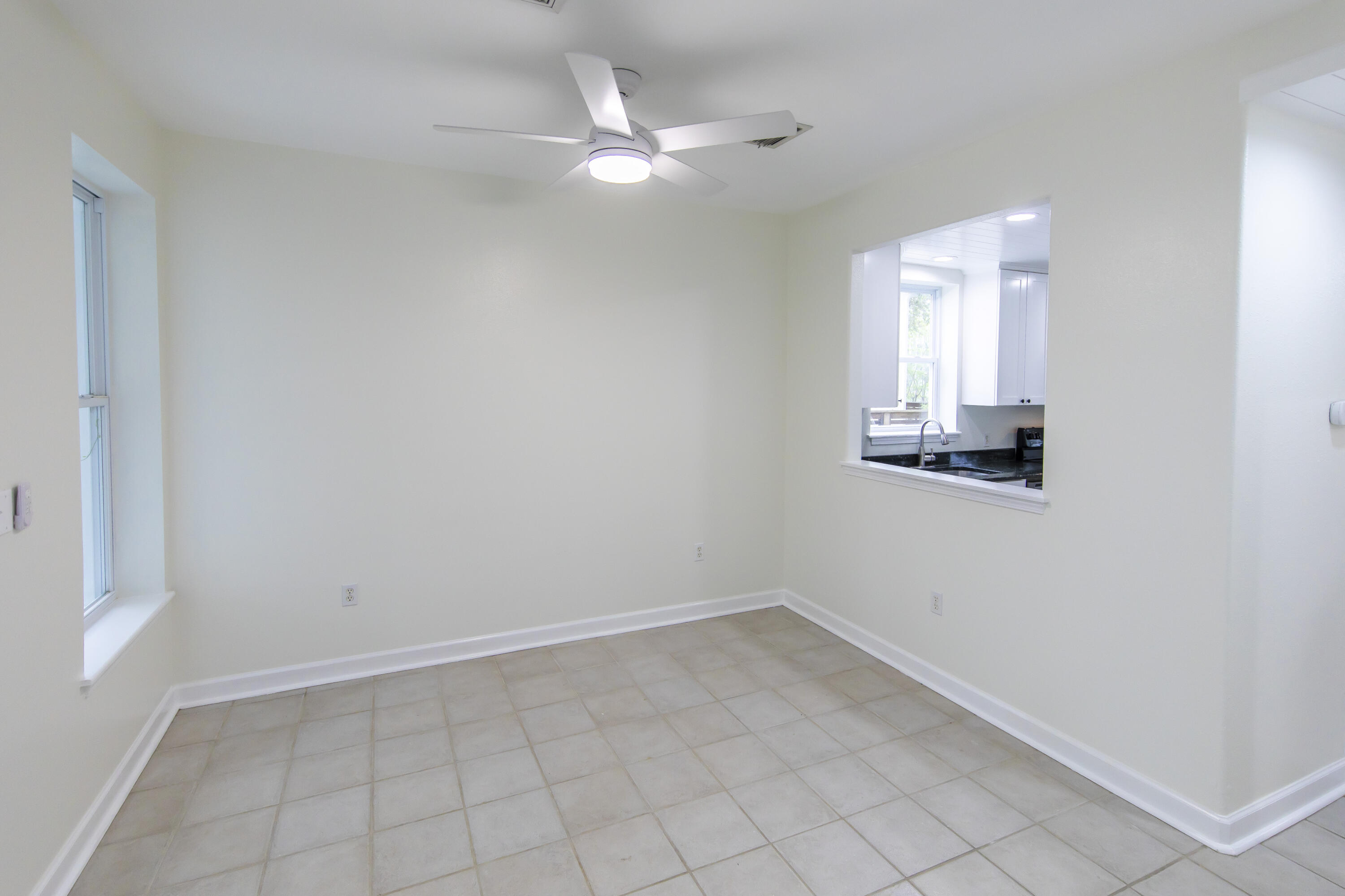 51 Loon Lake Drive Santa Rosa Beach, FL 32459 - Photo 19 of 49 an empty room with a window and chandelier fan