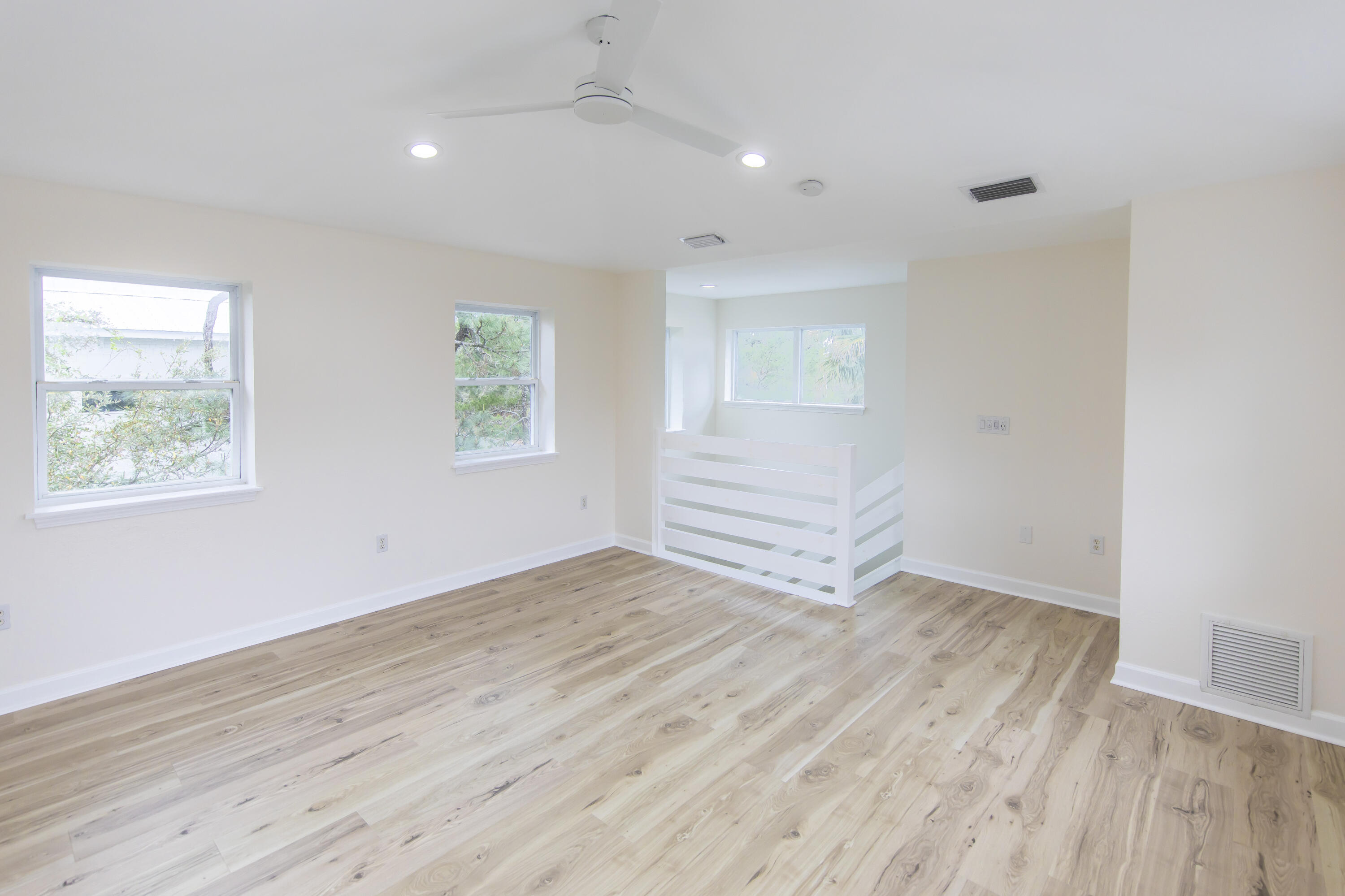 51 Loon Lake Drive Santa Rosa Beach, FL 32459 - Photo 38 of 49 an empty room with wooden floor and windows