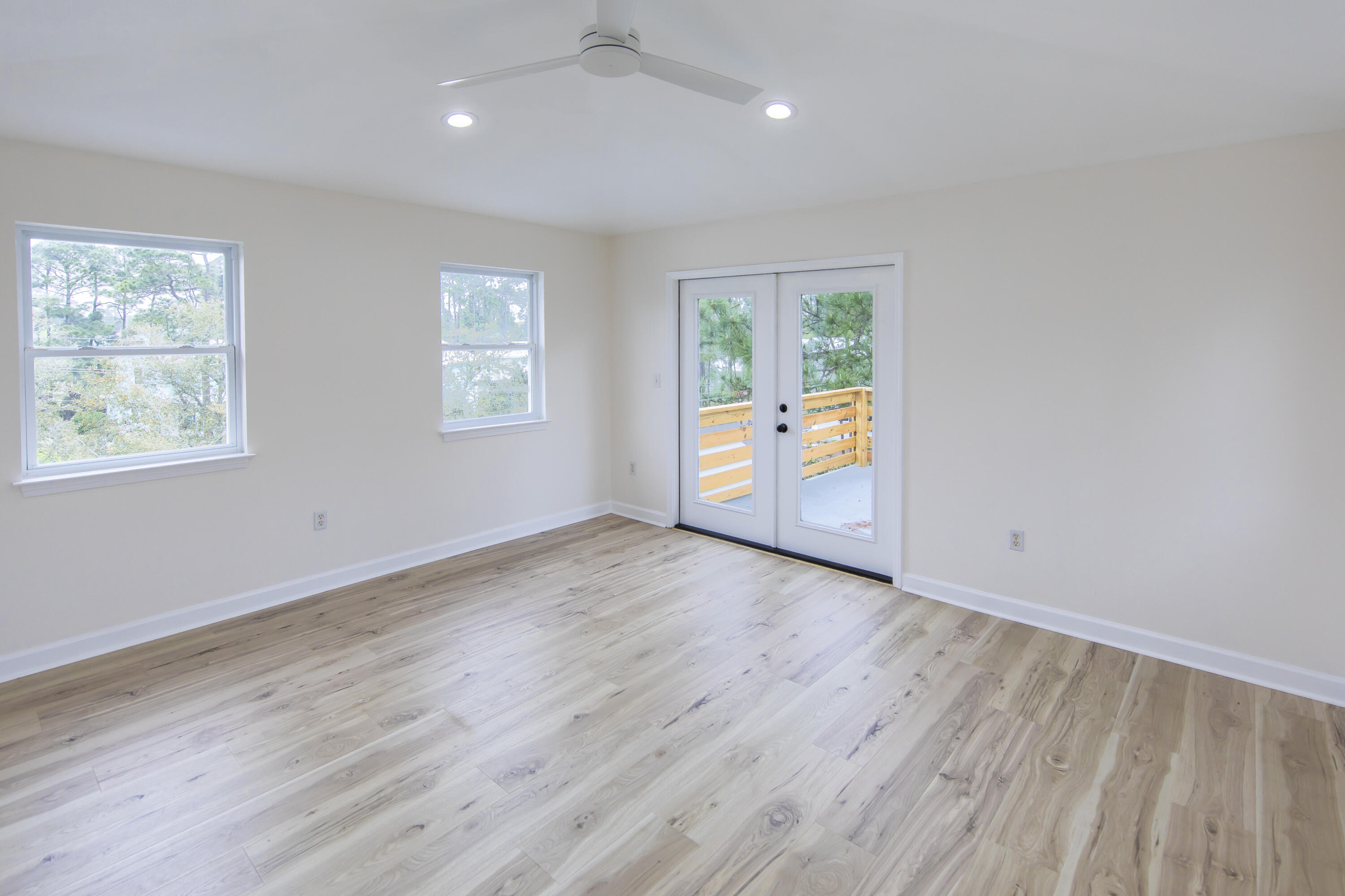 51 Loon Lake Drive Santa Rosa Beach, FL 32459 - Photo 39 of 49 an empty room with wooden floor and windows