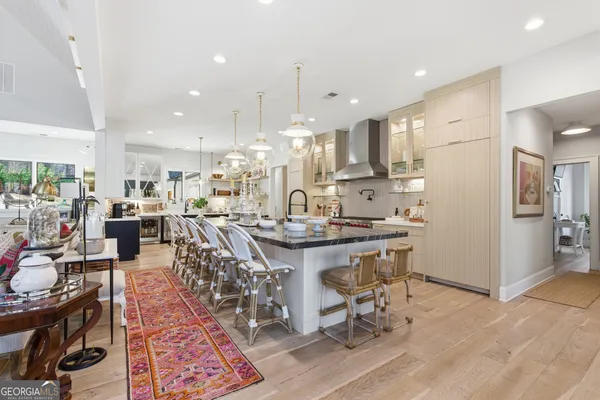 a spacious bathroom with a double vanity sink mirror double and toilet