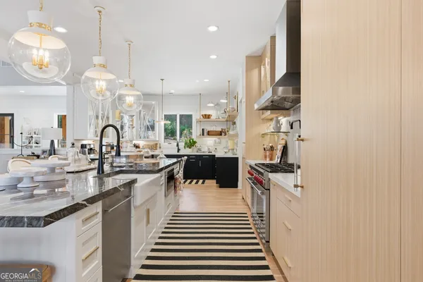 a living room with lots of furniture and a painting on the wall