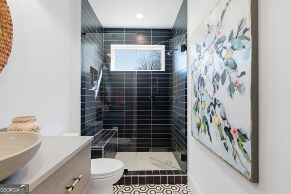 a close view of a utility room with dryer and washer
