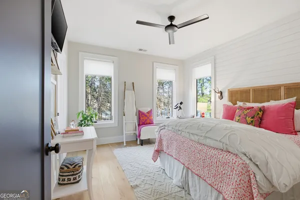 a living room with furniture a rug and a chandelier