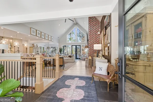 a large kitchen with lots of counter space dining table and chairs
