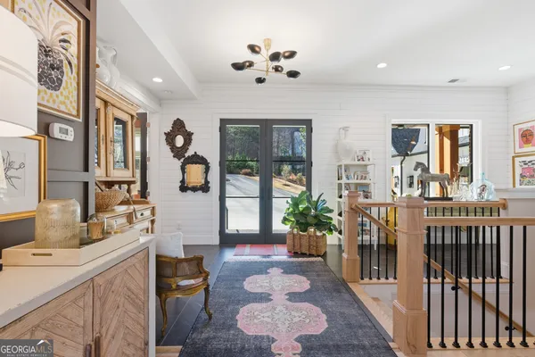 a large kitchen with a table and chairs