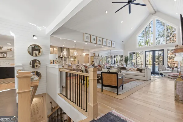 a kitchen with stainless steel appliances kitchen island granite countertop a sink and a refrigerator