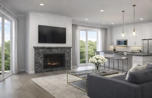 a living room with kitchen island furniture and a large window