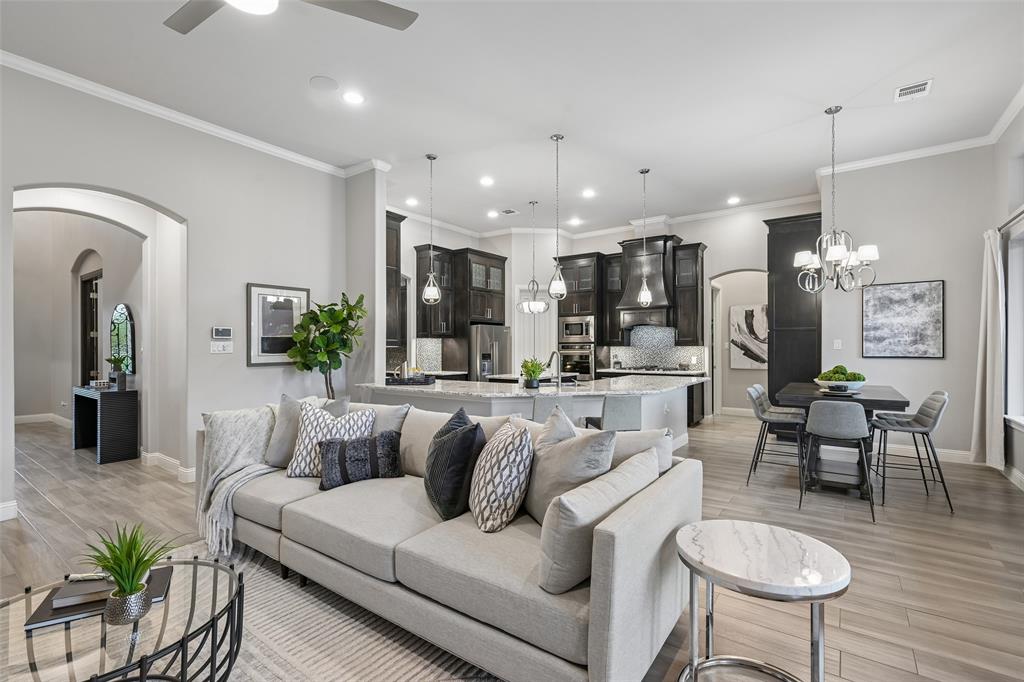 1657 Florence Road Keller, TX 76262 - Photo 11 of 40 a living room with furniture kitchen and a chandelier
