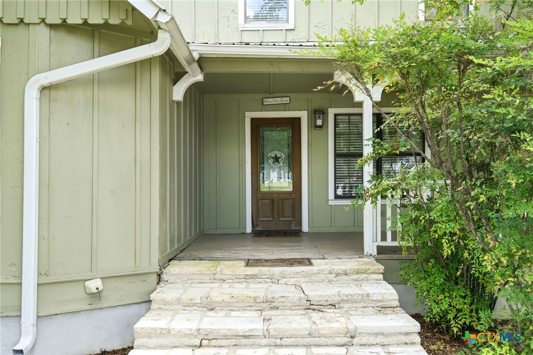 903 Summit Street Round Rock, TX 78664 - Photo 22 of 38 Front Entry with stone steps leading up to the wrap around porch.