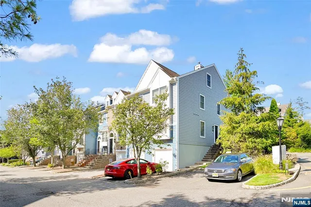 a view of street with parked cars