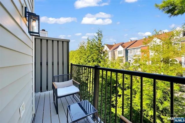 a view of a balcony with wooden floor