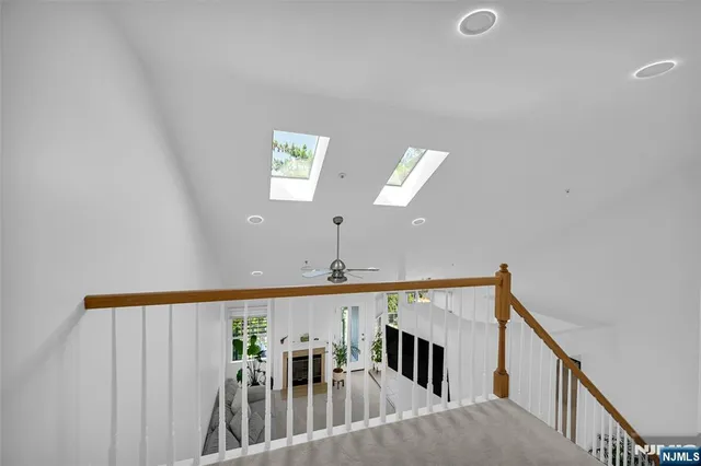 a view of a hallway with windows