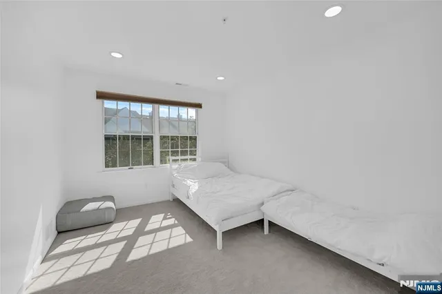 a room with a bed and a window