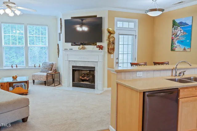a living room with furniture a chandelier and a window