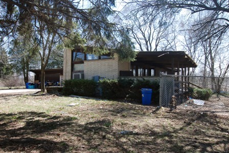 1500 North Green Bay Road Zion, IL 60099 - Photo 1 of 9 a front view of a house with a yard