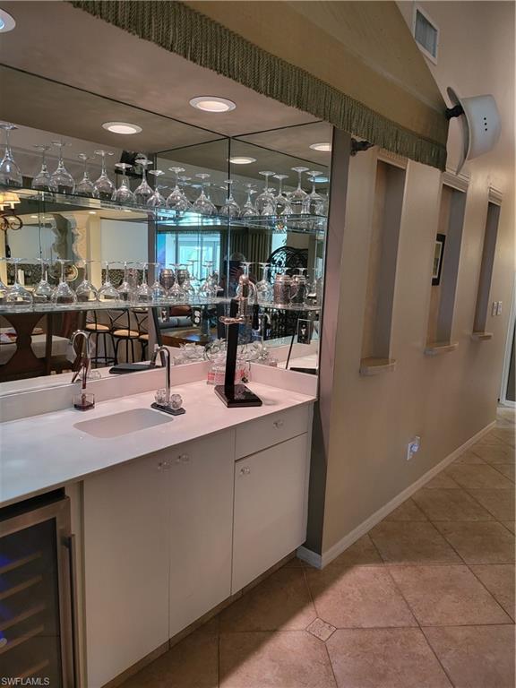 843 Marblehead Drive, Unit I3 Naples, FL 34104 - Photo 16 of 35 a kitchen with stainless steel appliances a sink and cabinets