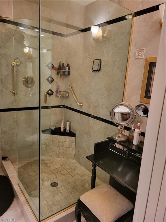 843 Marblehead Drive, Unit I3 Naples, FL 34104 - Photo 26 of 35 a bathroom with a shower and a sink