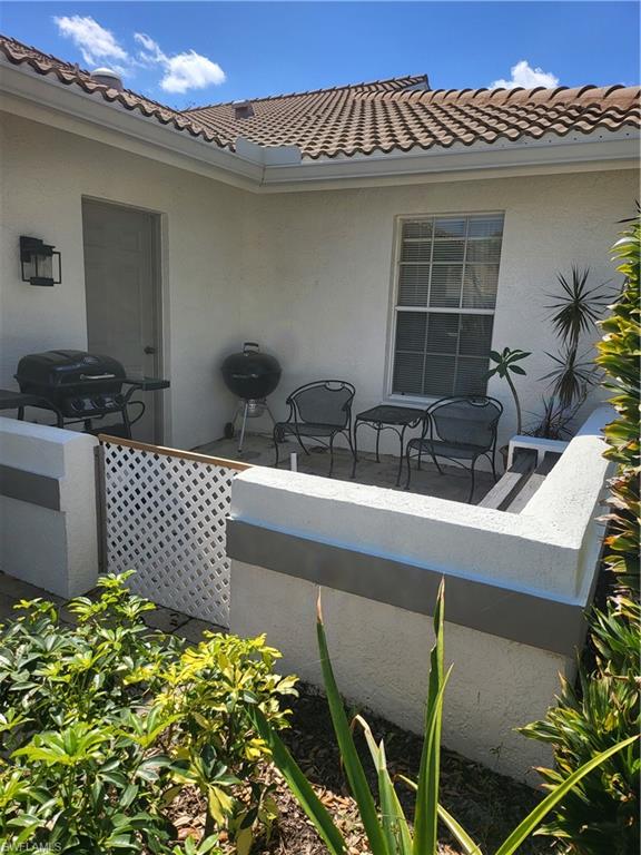 843 Marblehead Drive, Unit I3 Naples, FL 34104 - Photo 33 of 35 a view of a house with a flower pot