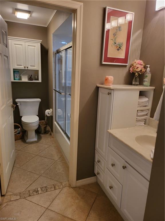 843 Marblehead Drive, Unit I3 Naples, FL 34104 - Photo 5 of 35 a bathroom with a sink toilet and mirror