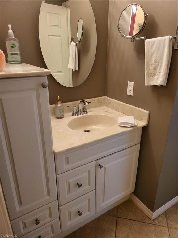 843 Marblehead Drive, Unit I3 Naples, FL 34104 - Photo 6 of 35 a bathroom with a sink and a mirror