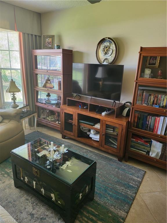 843 Marblehead Drive, Unit I3 Naples, FL 34104 - Photo 8 of 35 a living room with furniture and a flat screen tv