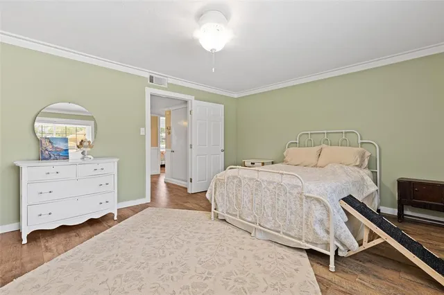 a bedroom with a bed and a dresser