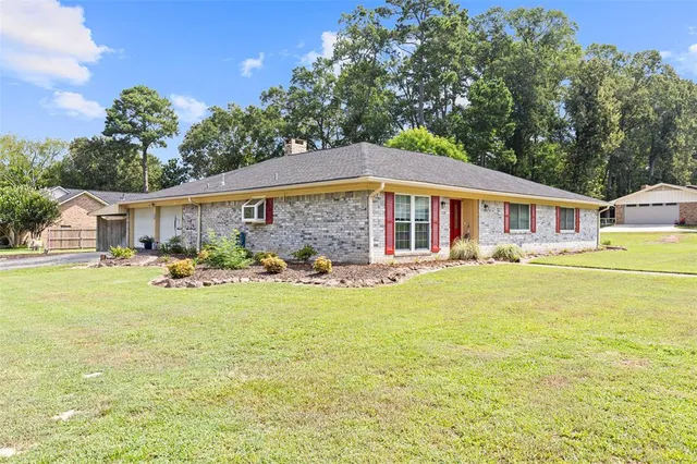 a view of a house with swimming pool and a yard