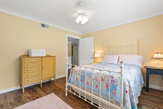 a bedroom with a bed and cabinets