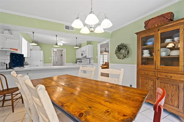 a view of a living room and kitchen
