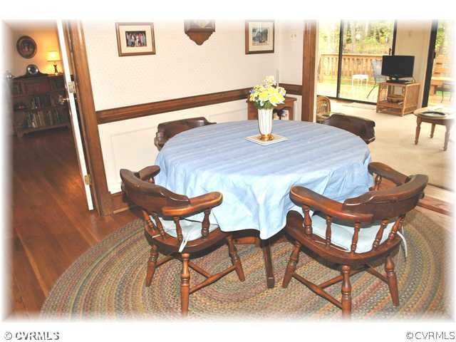 2521 Rochester Court Midlothian, VA 23113 - Photo 5 of 12 a view of a dining room with furniture and wooden floor