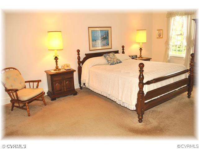 2521 Rochester Court Midlothian, VA 23113 - Photo 8 of 12 a spacious bedroom with a bed and chair