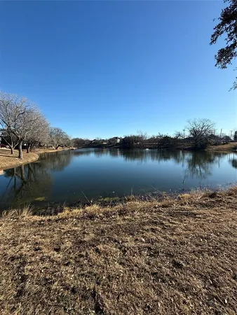 a view of a lake with a city