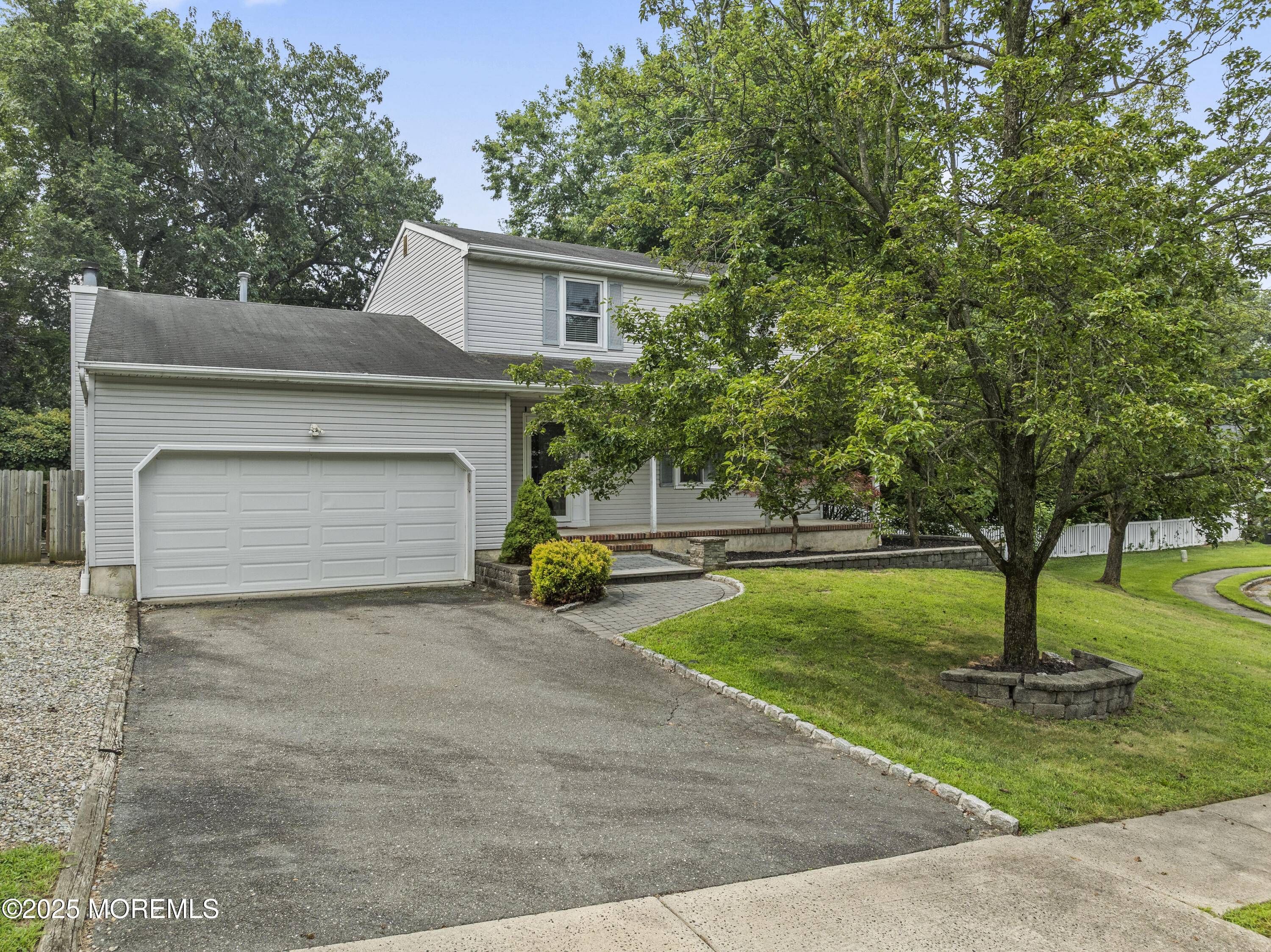 5 Windsor Court Hazlet, NJ 07730 - Photo 2 of 38 a view of a house with a yard and a garage