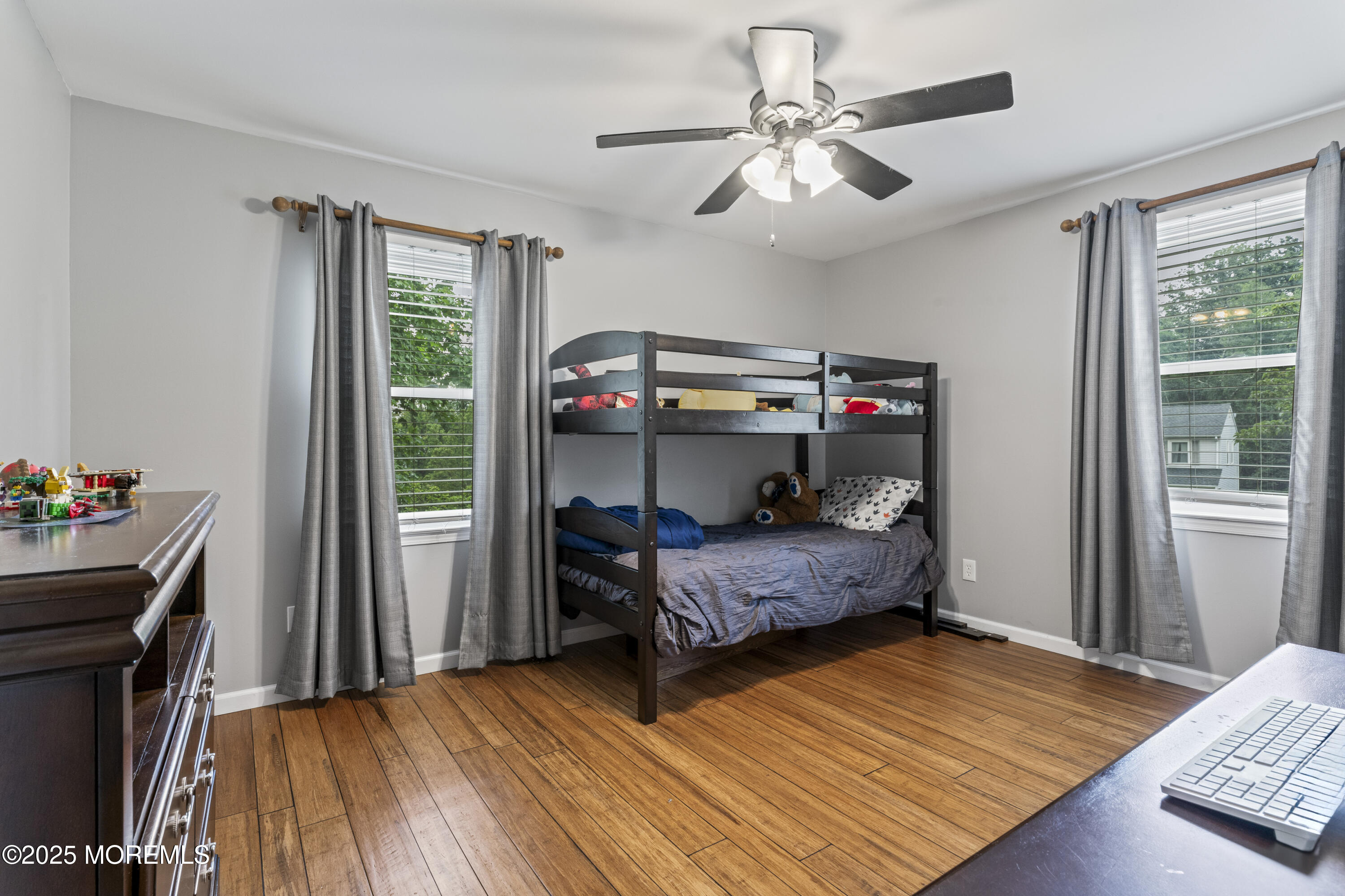 5 Windsor Court Hazlet, NJ 07730 - Photo 21 of 38 a bedroom with a bed and a chandelier