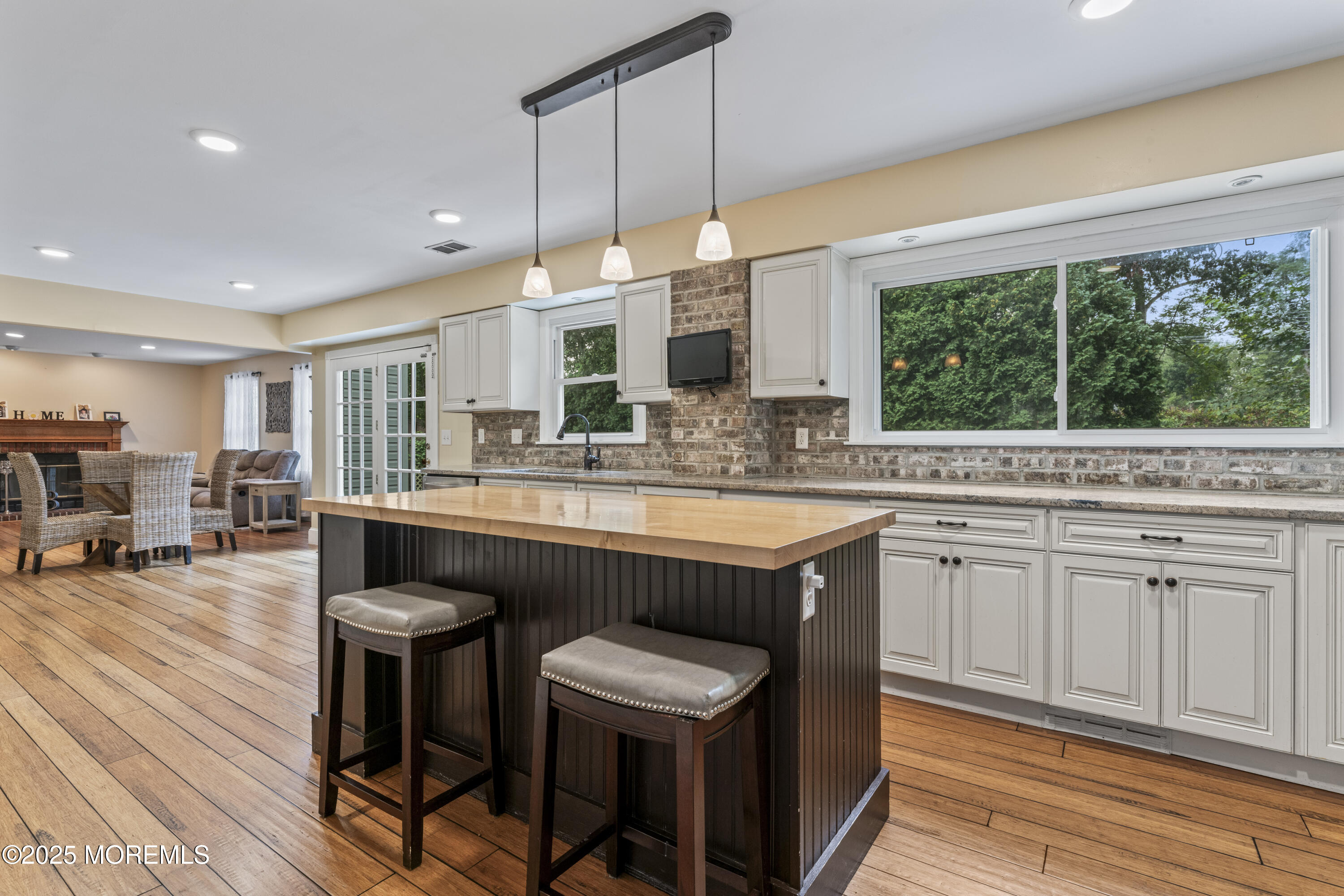 5 Windsor Court Hazlet, NJ 07730 - Photo 8 of 38 a kitchen with a table chairs sink and cabinets