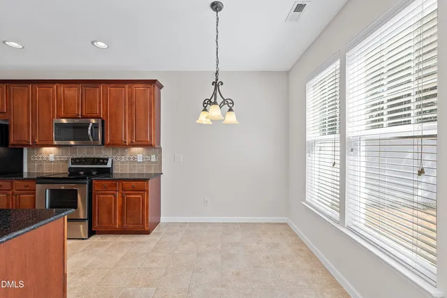 a sink with a granite countertop window